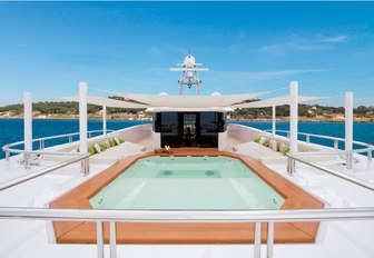 spa pool surrounded by sun pads on the sundeck of charter yacht Mogambo