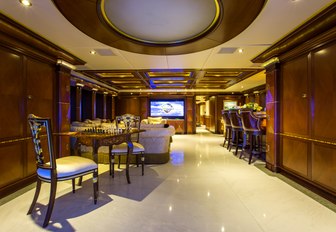 skylounge with games table, bar and seating on board luxury yacht My Seanna