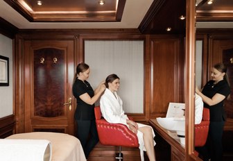 charter guest get her hair done in the salon aboard charter yacht TITANIA 