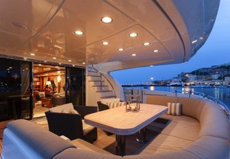 a quiet evening on the stern of motor yacht zambezi looking out towards a coastal town