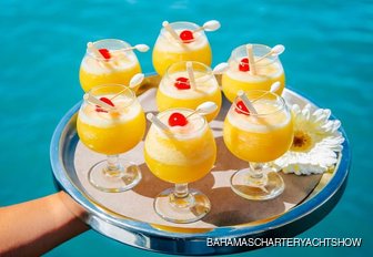 Tray of bright yellow cocktails