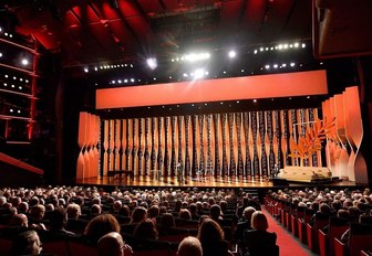 A-listers sit inside the Palais des Festivals at the Cannes Film Festival