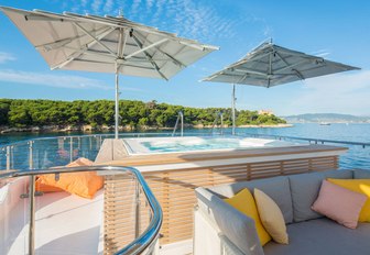 Spa pool under umbrellas on the sundeck of motor yacht DYNAR