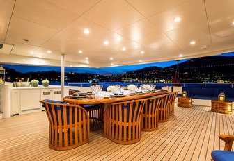 alfresco dining at night on board luxury yacht MISCHIEF 