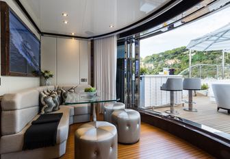 cosy nook on board charter yacht 11/11 opens onto deck area with bar