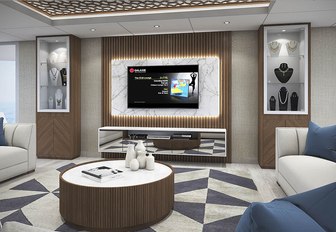 sofas face a TV in the main salon of charter yacht ELITE 