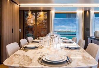 formal dining area in the main salon aboard charter yacht Vista Blue