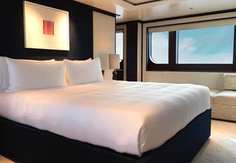 Charter yacht SOLACE guest cabin with central berth