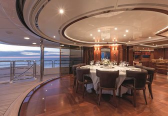 Semi al fresco dining on superyacht CHECKMATE