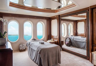 stateroom with large windows transforms into a massage room on board superyacht CALYPSO