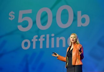 Woman on stage at MIPIM conference explaining her topic