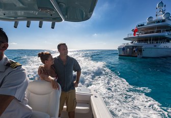 Couple on tender with Superyacht BACA in background