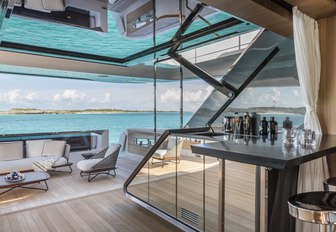 innovative doors and indoor-outdoor area on the main deck aft of motor yacht Vista Blue