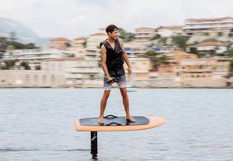 Charter guest on a foilboard
