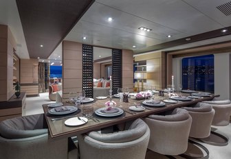 formal dining area in the main salon of motor yacht DYNAR