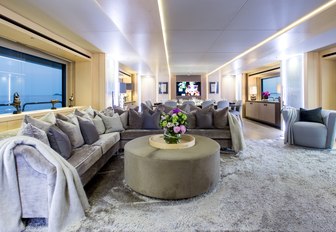 l-shaped sofa in stylish main salon on board superyacht BLUSH