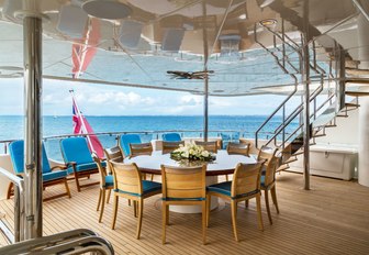 circular alfresco dining table on board motor yacht TRENDING 