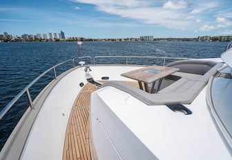 Charter yacht QUANTUM foredeck with table and seating