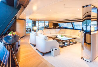 u-shaped sofa sits at the centre of the main salon aboard charter yacht Q