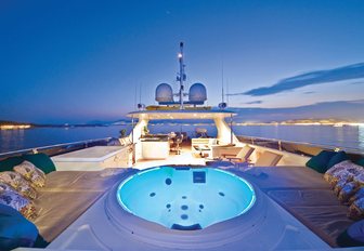 The sundeck and Jacuzzi on board M/Y One Last Toy