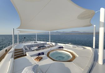 A Jacuzzi beneath bimini shading on board the superyacht of luxury yacht Da Vinci