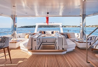 sections of the sun pad lift up to give entry into the beach club on the aft deck of luxury yacht JOY 