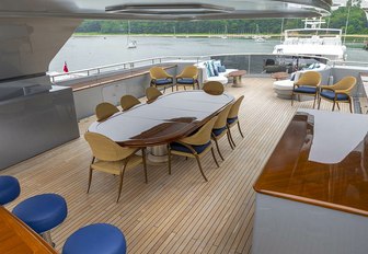 luxury yacht sundeck with dining and bar