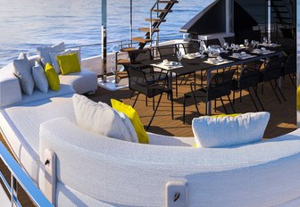 alfresco dining area on upper deck aft of motor yacht December Six 