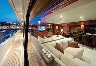 view of classically-styled skylounge from side deck of motor yacht ‘One More Toy’ 