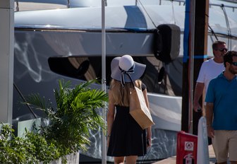 Woman looks at yacht during FLIBS 2019