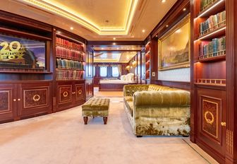 Charter yacht BLACK PEARL cinema room with bookshelves