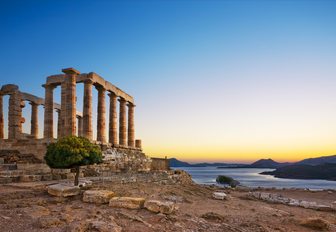 Ancient ruins overlooking the sea at sunset