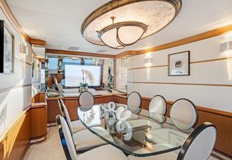Charter yacht XOXO interior dining area with long table