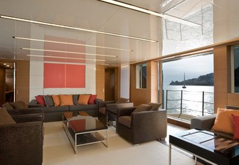 Main salon of luxury motor yacht 4A from Sanlorenzo, with balconies visible and ocean see beyond