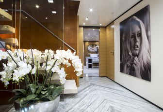 chic and contemporary hallway with huge photograph of model aboard charter yacht MISCHIEF