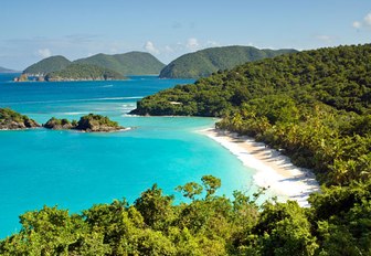 dazzling white sand beach in Costa Rica with turquoise waters and lush interior