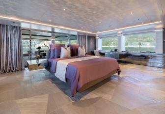 Superyacht charter SALT master cabin overview with central berth and surrounding windows