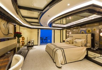 sycamore-clad master suite with drop-down balcony on board luxury yacht OKTO