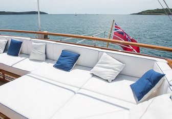 outdoor lounging area on board charter yacht MALAHNE