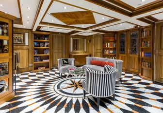Charter yacht AQUA LARES library with armchairs