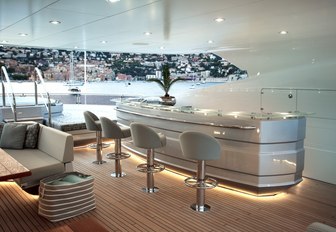 bar, seating and Jacuzzi on the sundeck of luxury yacht ARADOS