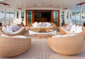 outdoor seating area on the aft deck of motor yacht SHERAKHAN