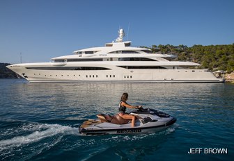 a woman enjoying the rrefreshing waters of the Mediterranean while on her luxury yacht charter adventure through the Mediterranean 