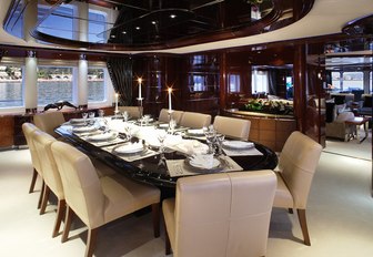 Art Deco-style formal dining area in main salon aboard superyacht Talisman Maiton