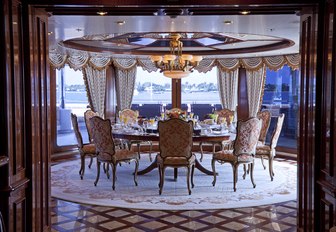 formal dining area surrounding by windows on board luxury yacht Martha Ann