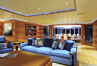 warm and welcoming upper lounge with Zebrano wood on board luxury yacht TV