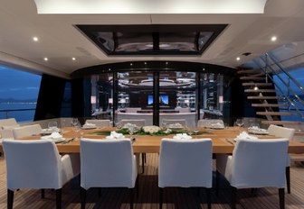 alfresco dining setup on the upper deck aft of charter yacht MYSKY