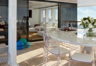 heesen yacht home seating area with glass table