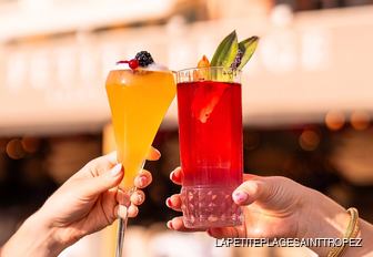 Two cocktails being toasted