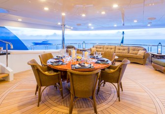 alfresco dining area on the upper deck aft of motor yacht Amarula Sun 